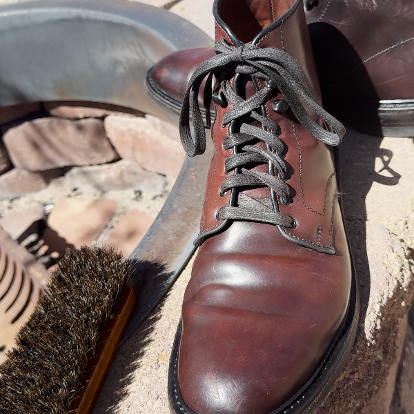 Shell cordovan boot sitting atop a fire pit