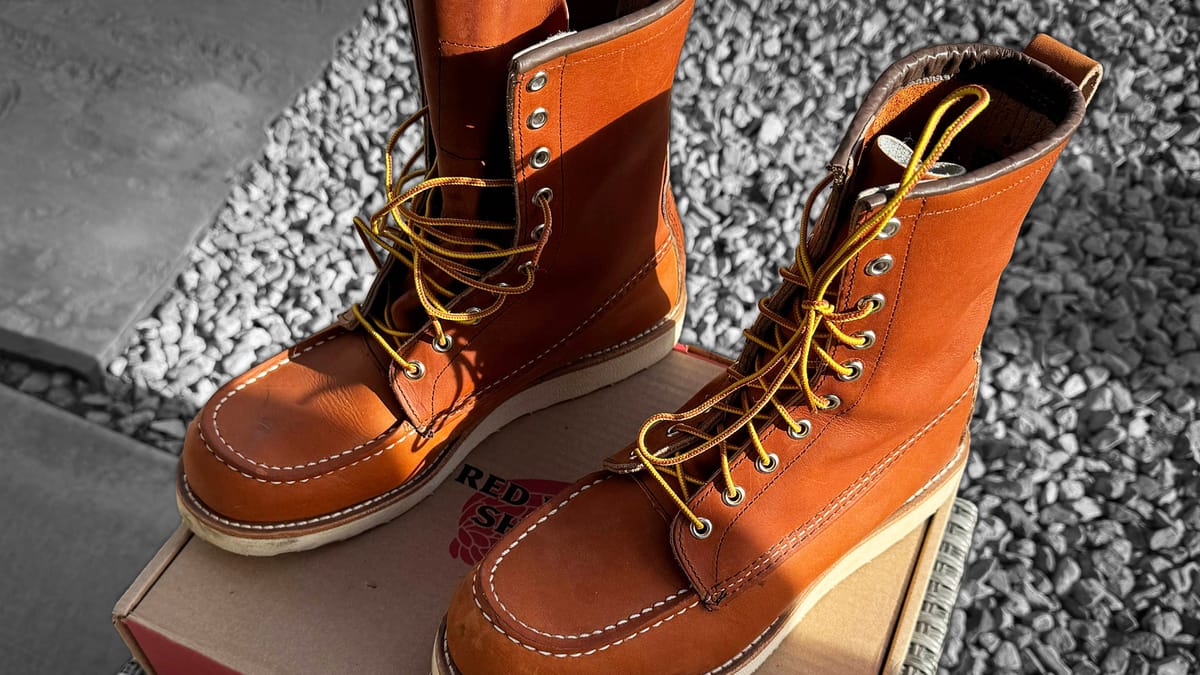 A pair of Red Wing Heritage 877 boots sitting on their box