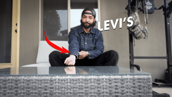 Bryan from Splished sitting, with a red arrow pointing the a Levi's jacket