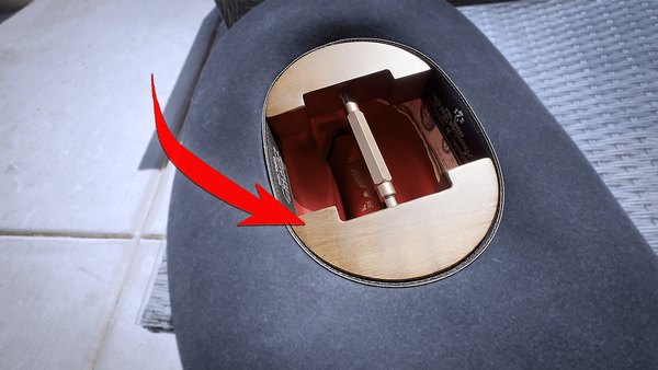 A hat stretcher inserted into a felt cowboy hat