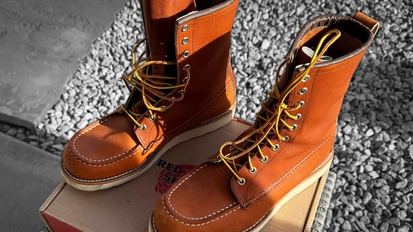 A pair of Red Wing Heritage 877 boots sitting on their box